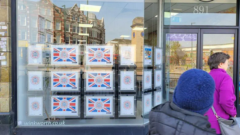 An office window shows coronation posters in Golders Green, a heavily Jewish neighborhood