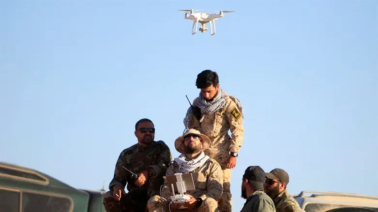 Drone hovers over Hezbollah fighters