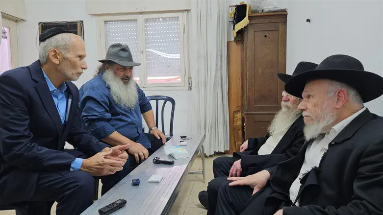 Omer Bar Lev (l) and Yaron Angel (r) visit Rabbi Edelstein's family