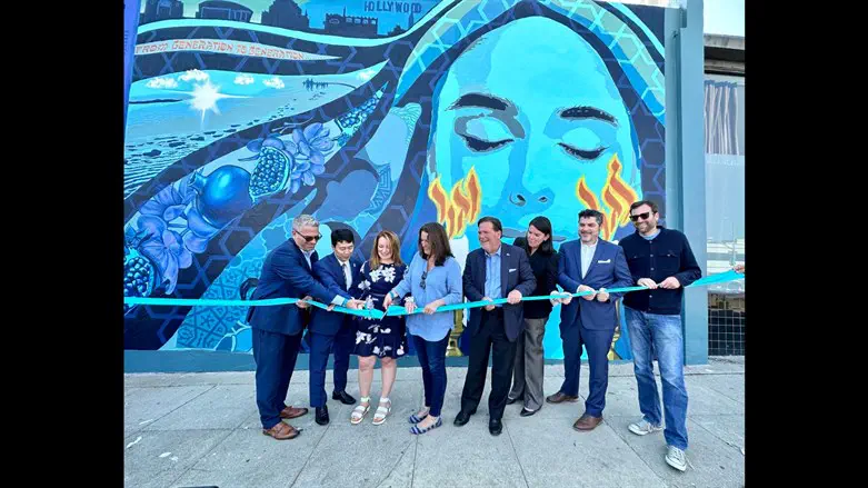 Los Angeles leaders cut the ribbon for the unveiling of a new mural in the Pico-
