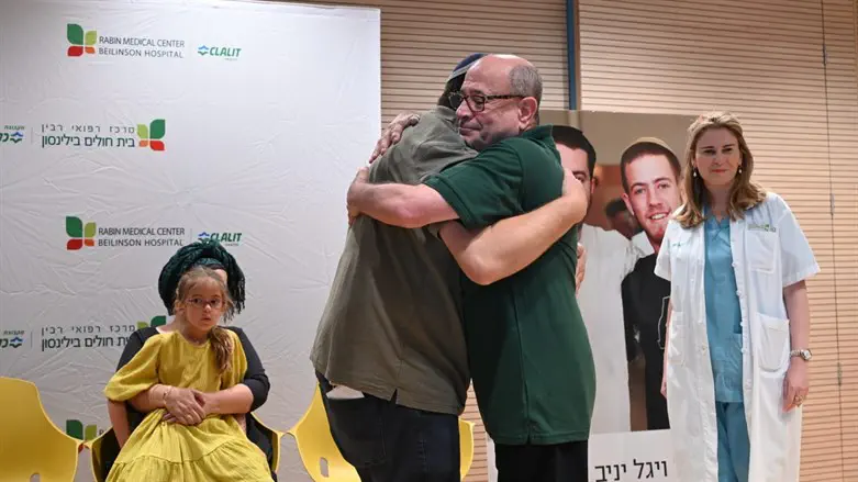The Yaniv boys' father embraces one of the recipients