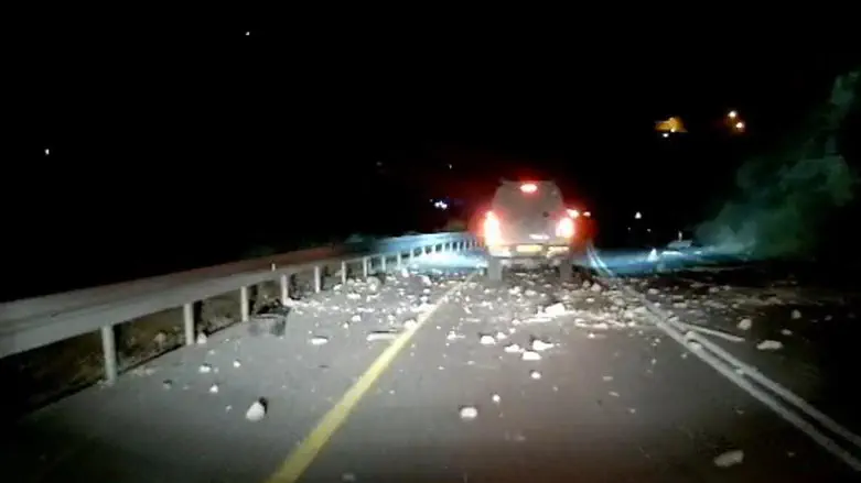 road covered in stones after riot