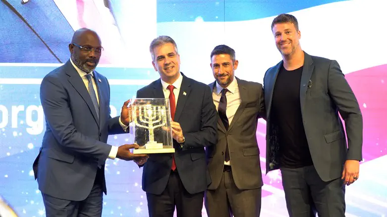 From right: Michael Evans, Nir Kimhi, Foreign Min. Eli Cohen, & Liberian Pres. George Weah