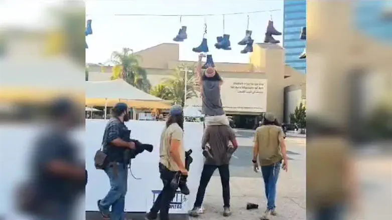 Hilltop Youth collect abandoned military boots