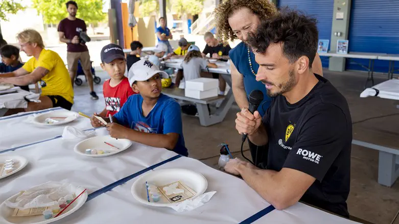 Borussia Dortmund player Mats Hummels participates in a Holocaust education program