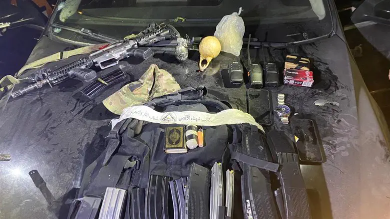 Rifle and weapons seized at the scene
