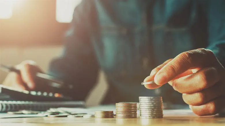 Man counts stack of coins