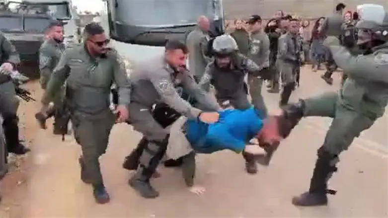 The victim being beaten by police