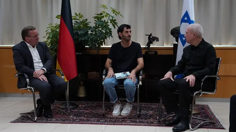 Liri Romann, sitting with the Ministers of Defense of Israel and Germany.