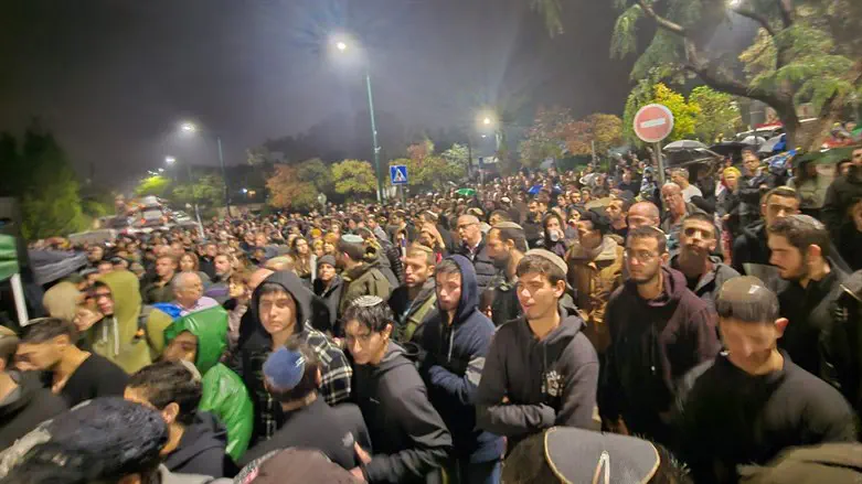 Thousands attend the funeral of Captain Eitan Fisch, who was killed fighting in Gaza