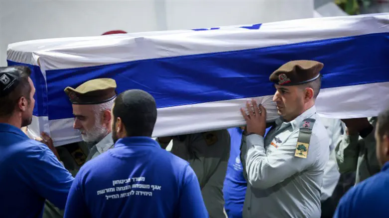 Fellow Golani officers carry the casket of Lieutenant Colonel Tomer Grinberg
