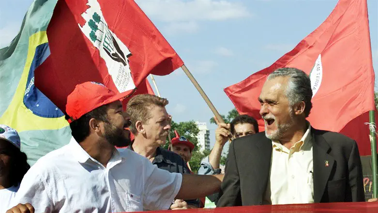 Jose Genoino (R) joins Joao Paulo Rodrigues