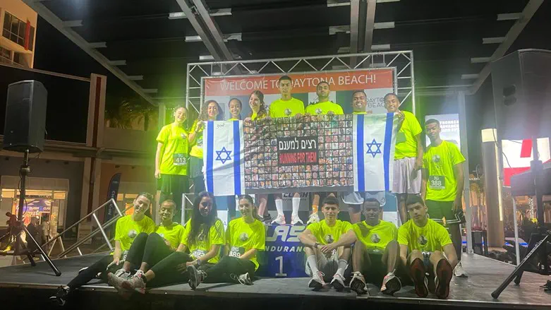The children holding photos of the hostages