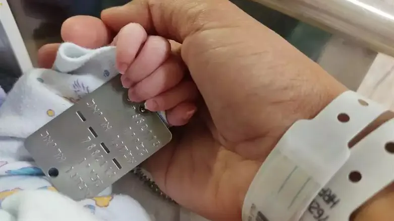 Klein's daughter with her father's dog tag