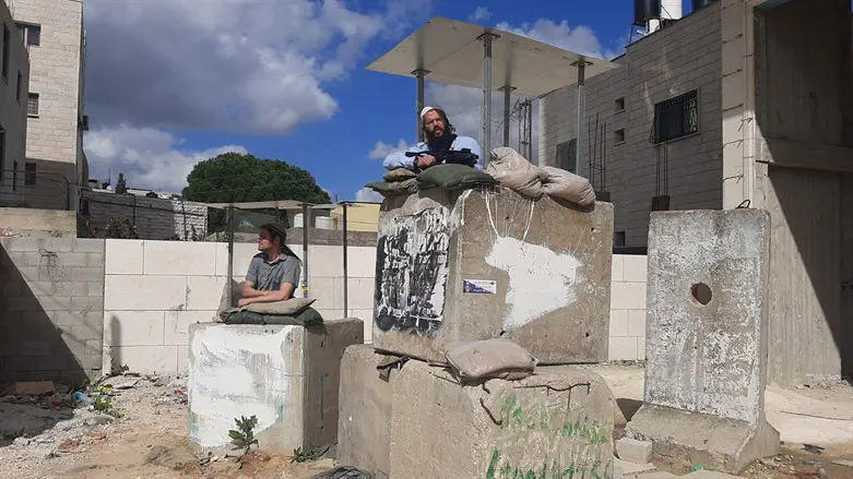 Residents guarding the road in Huwara