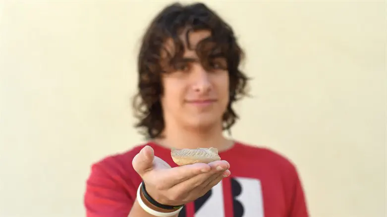 Yonatan Frankel and the lamp that he found.