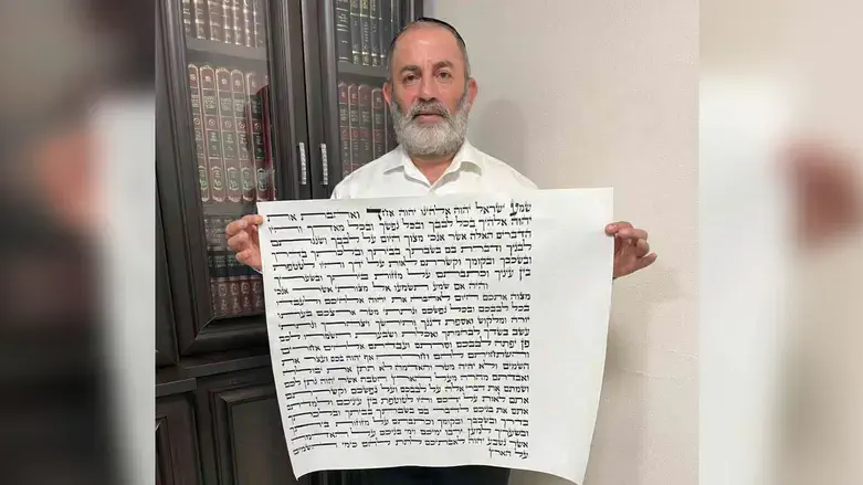 Rabbi Meir Peretz with the mezuzah