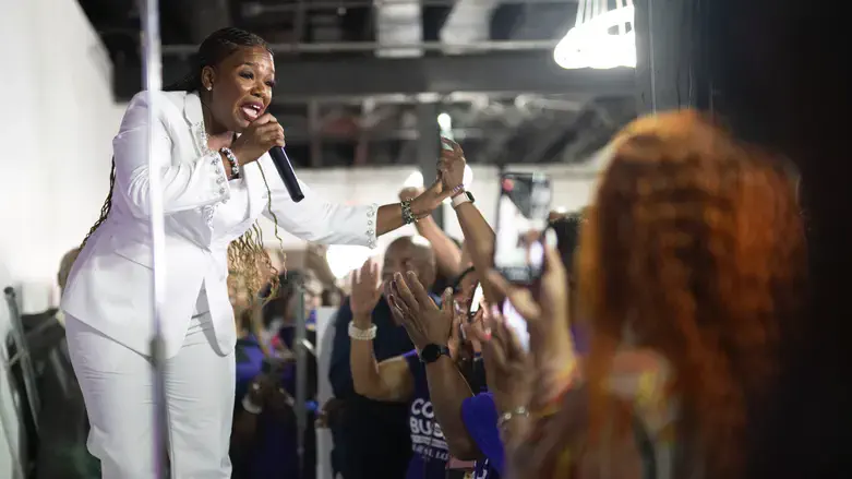Rep. Cori Bush gestures to the crowd prior to delivering her concession speech