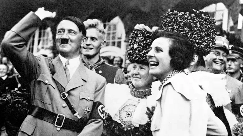 Adolf Hitler & filmmaker Leni Riefenstahl during a Nazi rally in Nuremberg, Germany, 1934.