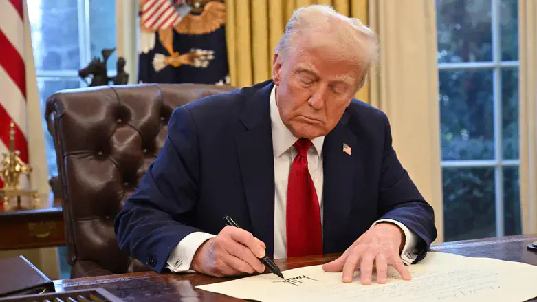 President Donald Trump signs an executive order