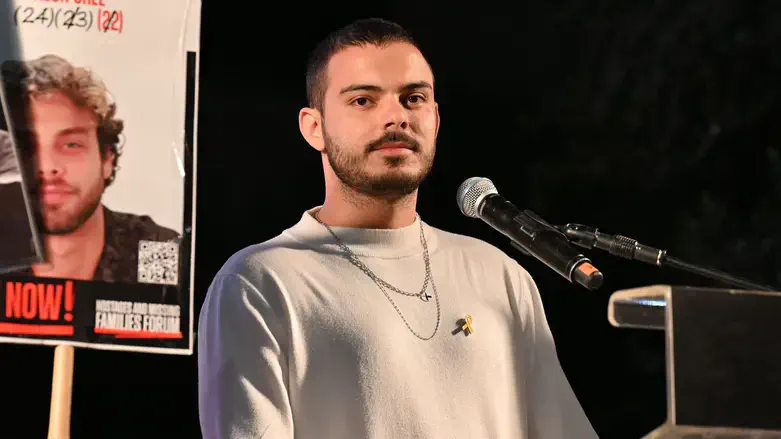 Omer Wenkert speaks at the rally