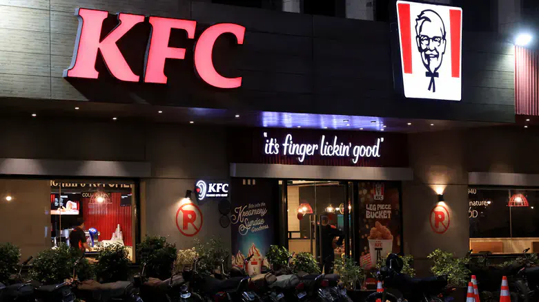 Security guard at KFC entrance in Karachi