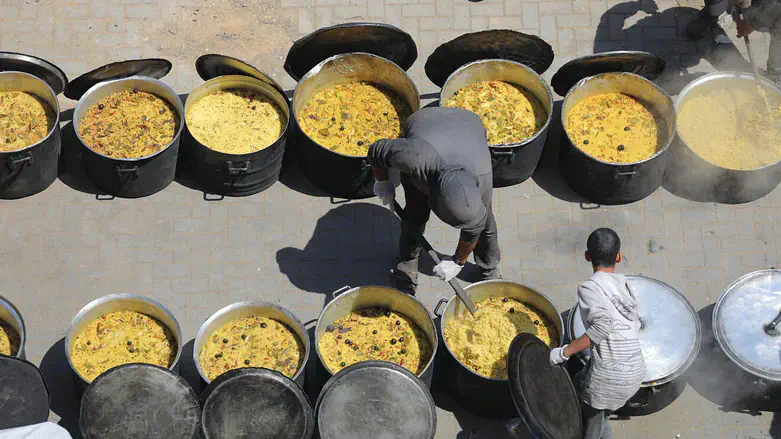 Food to Arabs in Nuseirat camp in Gaza Strip