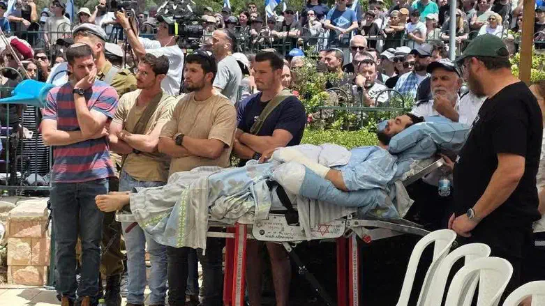 Yishai Urbach's wounded friend at his funeral