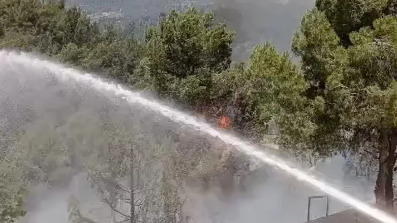 Firefighters work to put out fire near Har Nof