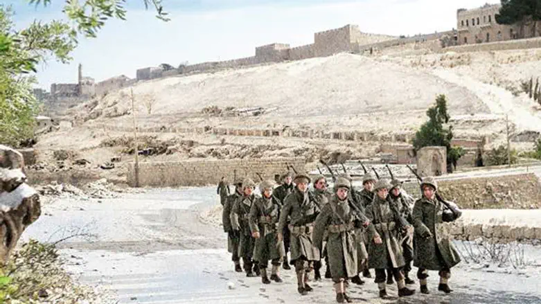 Soldiers march along the municipal border