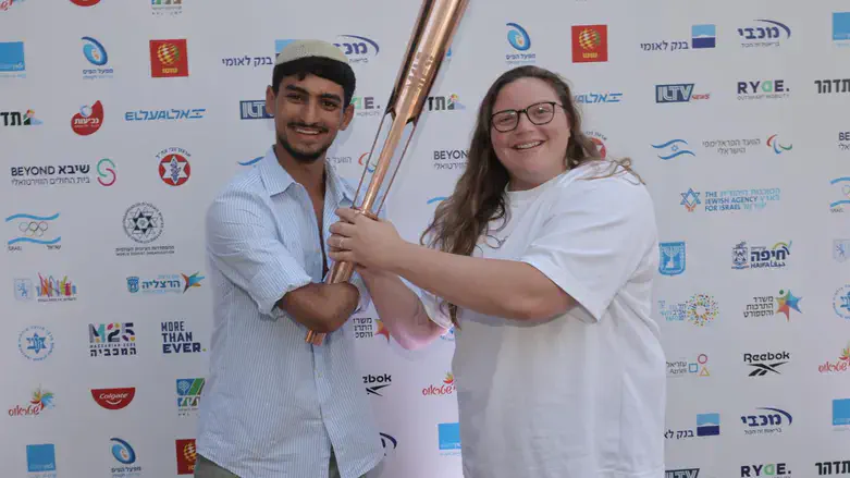 Asaf Yasur and Raz Hershko with the torch