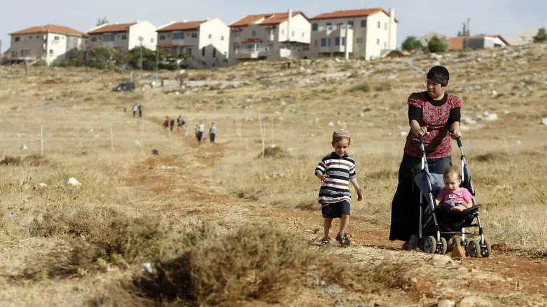 Jewish woman and children walking in Samaria