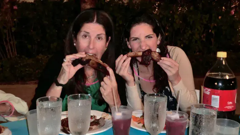 Jewish women enjoy Passover meal in Florida in 2012 with corn syrup-free, yellow-cap Coke.