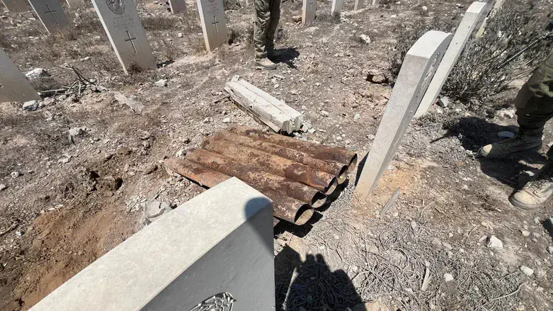 Missile launcher and launch canisters in a cemetery