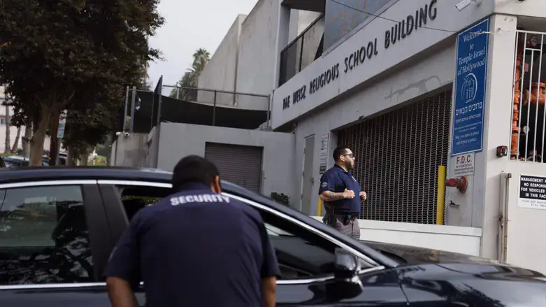 Security guards stand watch in front of a synagogue on Oct. 9, 2023 in Los Angeles.