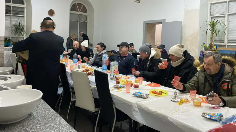 Ukrainian refugees enjoy a meal at the Agudath Israel synagogue in Chisinau, March, 2022.