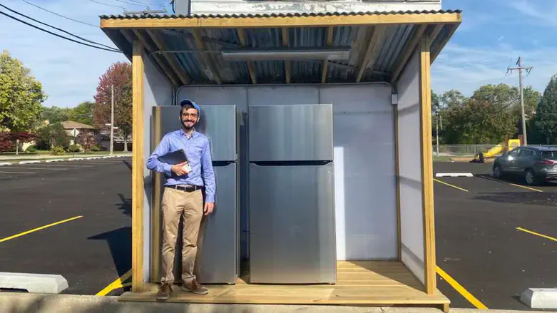 Rabbi Hody Nemes stands in front of Hersh's Fridge, a kosher community fridge in Chicago.