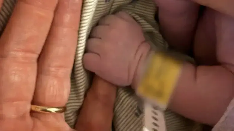 Amit Segal with his newborn son