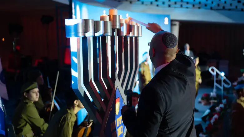 Lighting the chanukiya