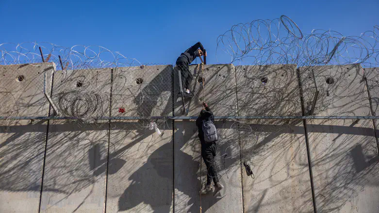 illegal entrants climb over fence