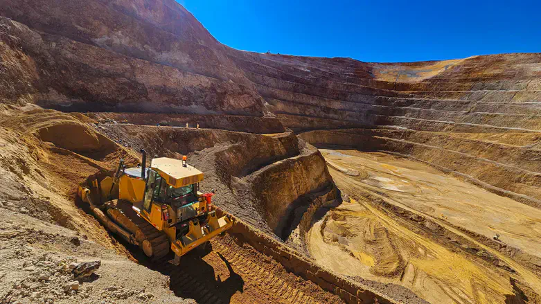 Construction machinery works in open mine