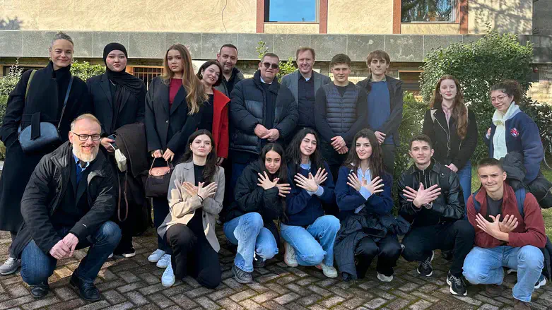 Students and their teachers from both schools pose for a group shot