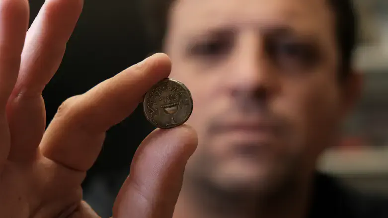 Ilan Haddad with an ancient shekel coin