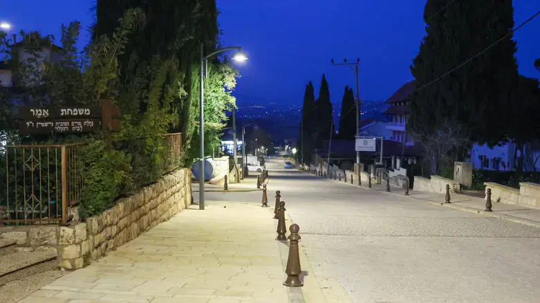 Metula’s streets lie mostly empty at night as residents head to shelters.