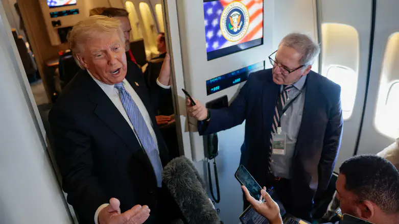 Trump speaks to reporters on Air Force One