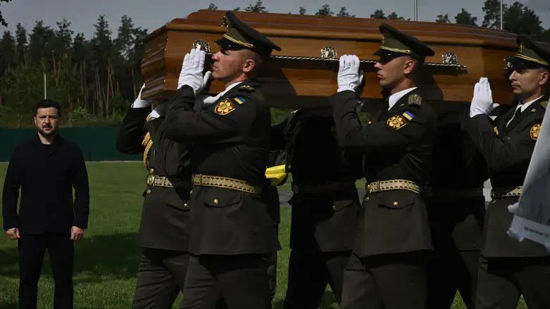 Ukraine's President Volodymyr Zelenskyy attends the reburial ceremony of Andriy Melnyk