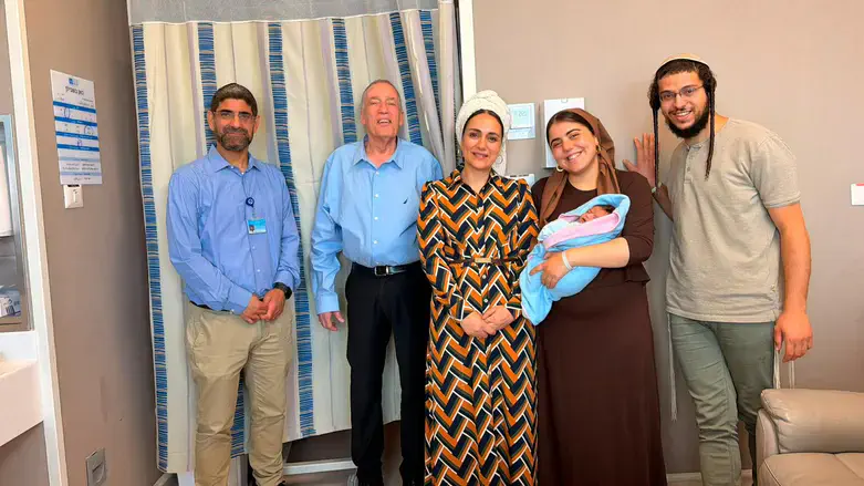 With the doctors following the joyous delivery