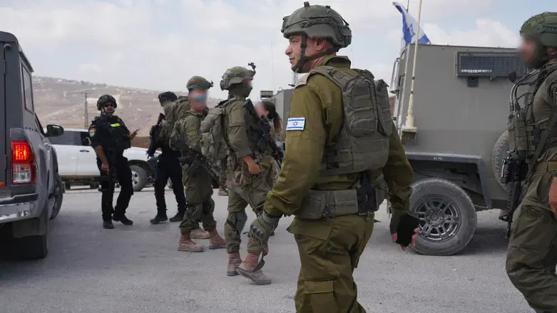 IDF soldiers at the scene of the Havat Gilad terror attack