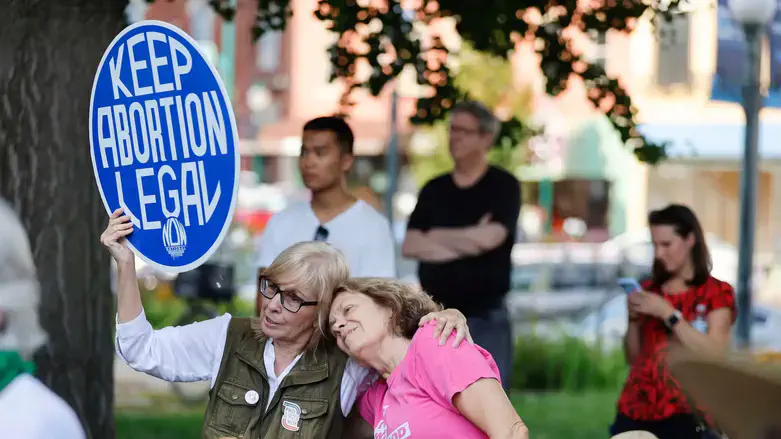 Protesters associated with Hoosier Jews for Choice gather outside Monroe County Courthouse