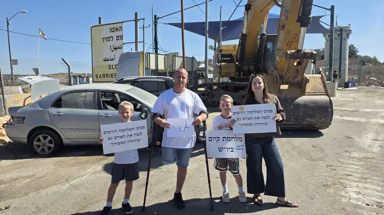 Ofir Engelsman with his family at the scene of the attack